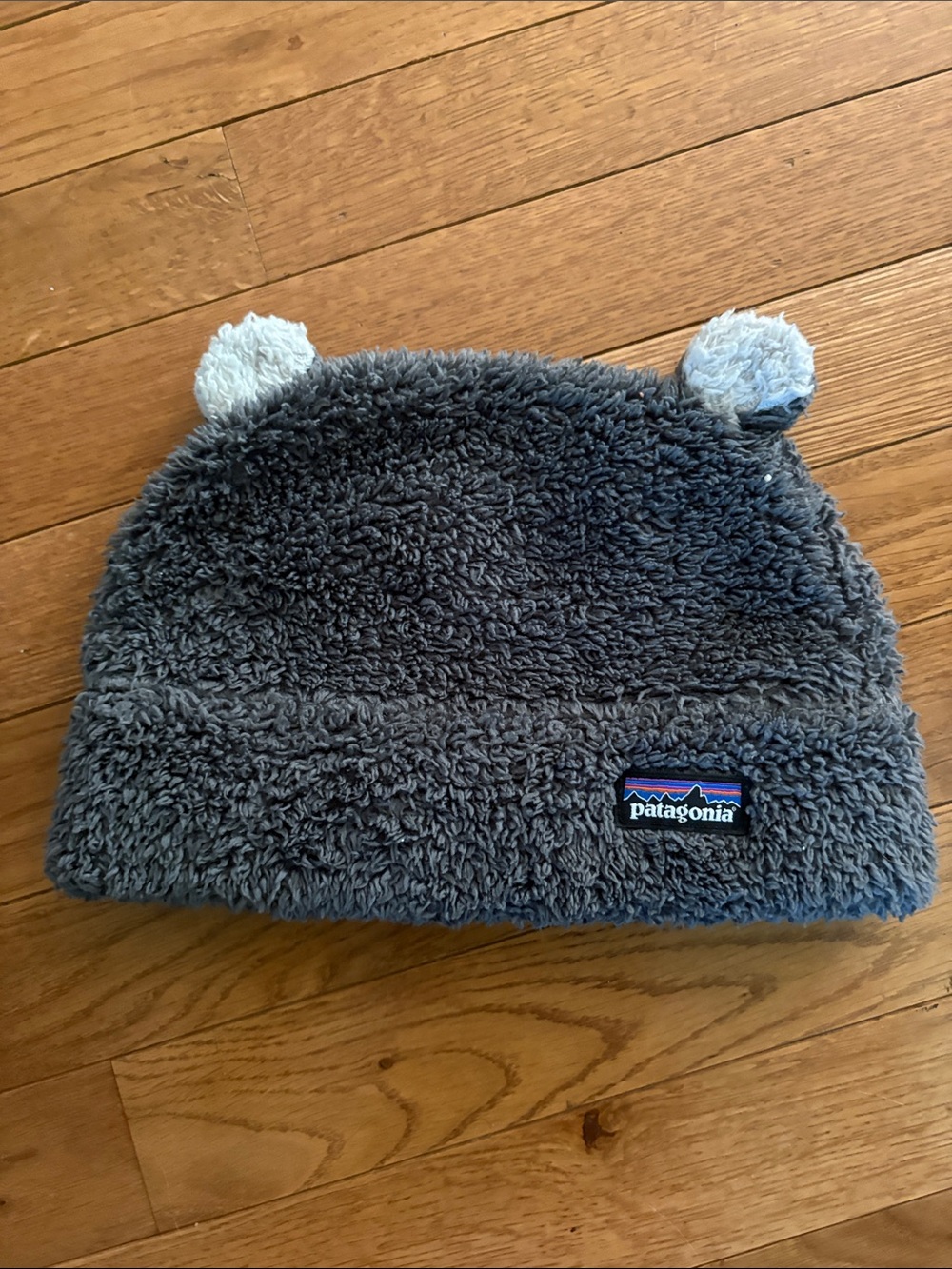Patagonia Plush Bear-Ear Fleece Beanie in Charcoal. 5T
